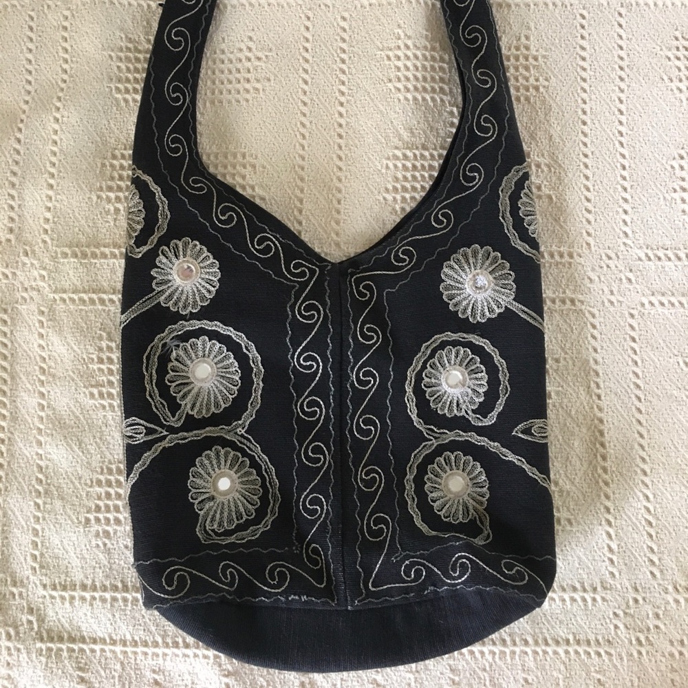 Black and white embroidered bag with mirrors